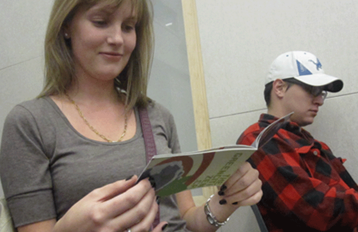 Seneca student checks out the Green Citizen Handbook